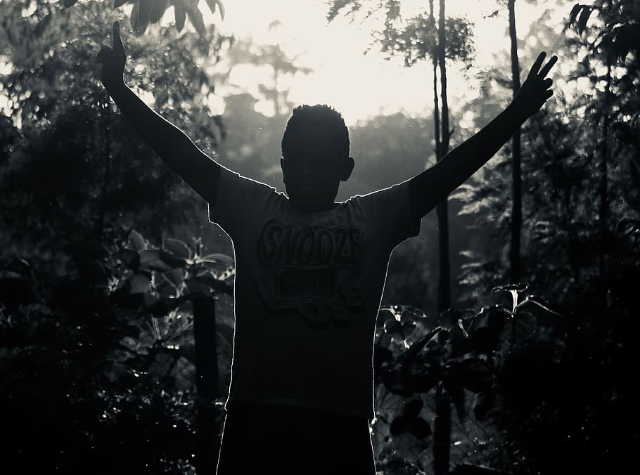 Gray Scale Photo of Man in White Shirt Raising His Hand Near Plants, backlit, black-and-white, boy, dark, fog, foggy, hands, kid, landscape, light, man, nature, outdoors, person, pose, profile, silhouette, trees, wear, young, HD wallpaper