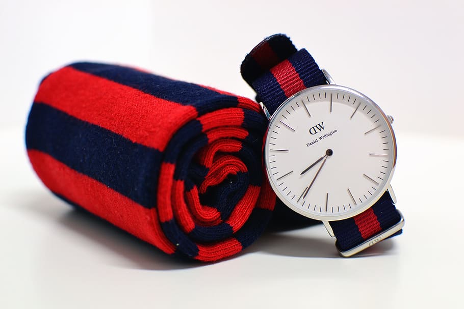 round silver-colored Daniel Wellington analog watch beside red-and-blue striped scarf, accessories, watch, clock, time, cloth, fabric, textile, fashion, design, wrist watch, modern, set, style, men, chronometer, HD wallpaper