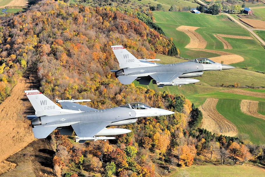 Two flying silver aircraft, wisconsin, jets, fighters, autumn, fall