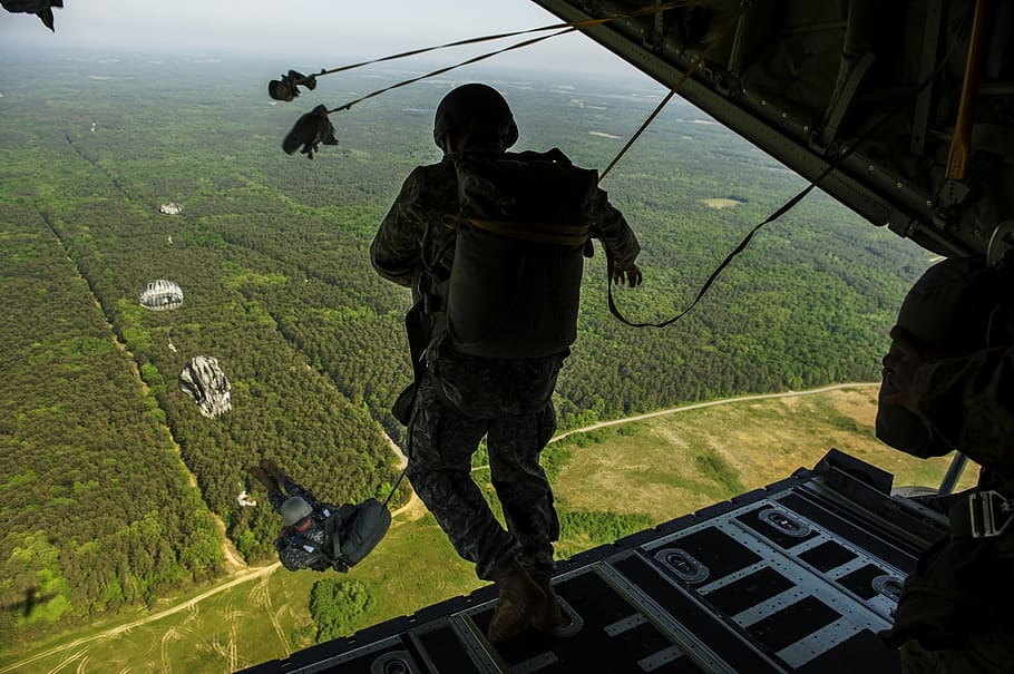 People doing jumping out of plane skydiving during daytime, people ...