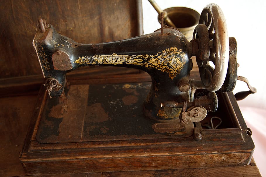 Black and brown sewing machine, ancient, antique, domestic, equipment