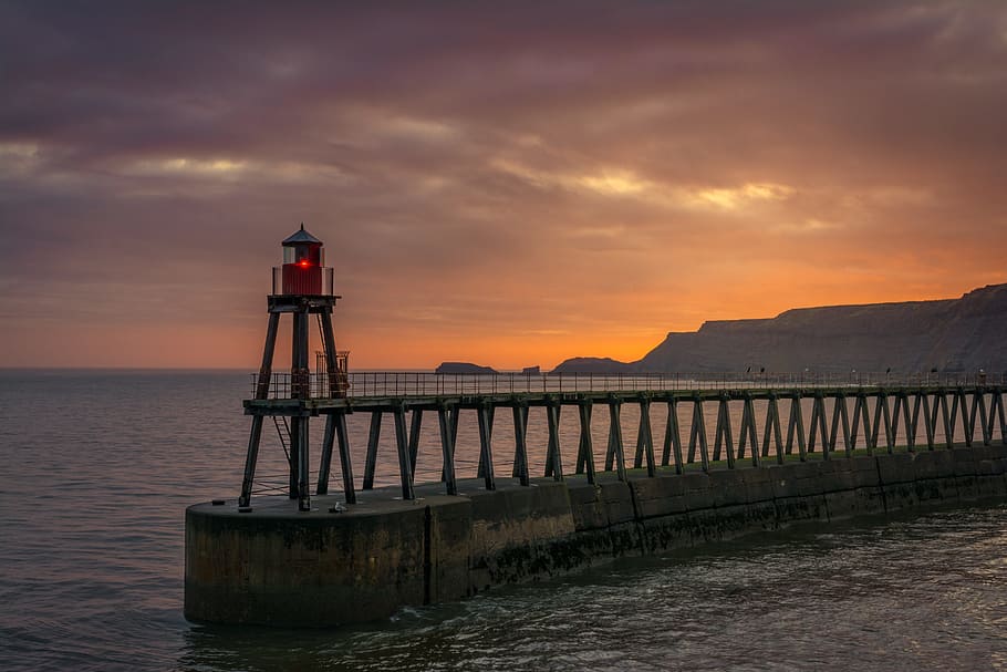 Lighthouse in body of water photo, whitby, east pier, beacon, yorkshire ...